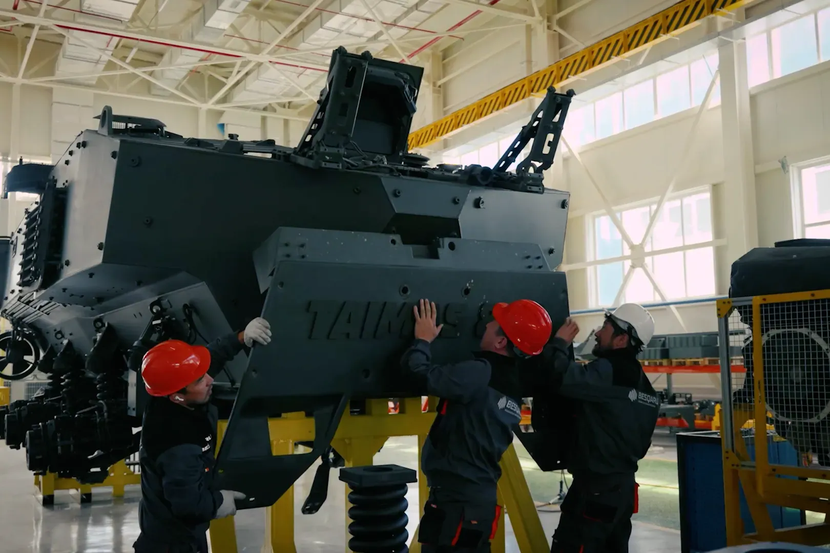 Workers fitting an armoured hull